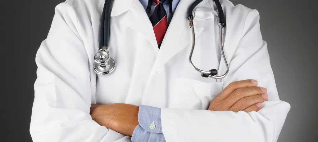 close up image of a doctor in a white jackets with a stethoscope