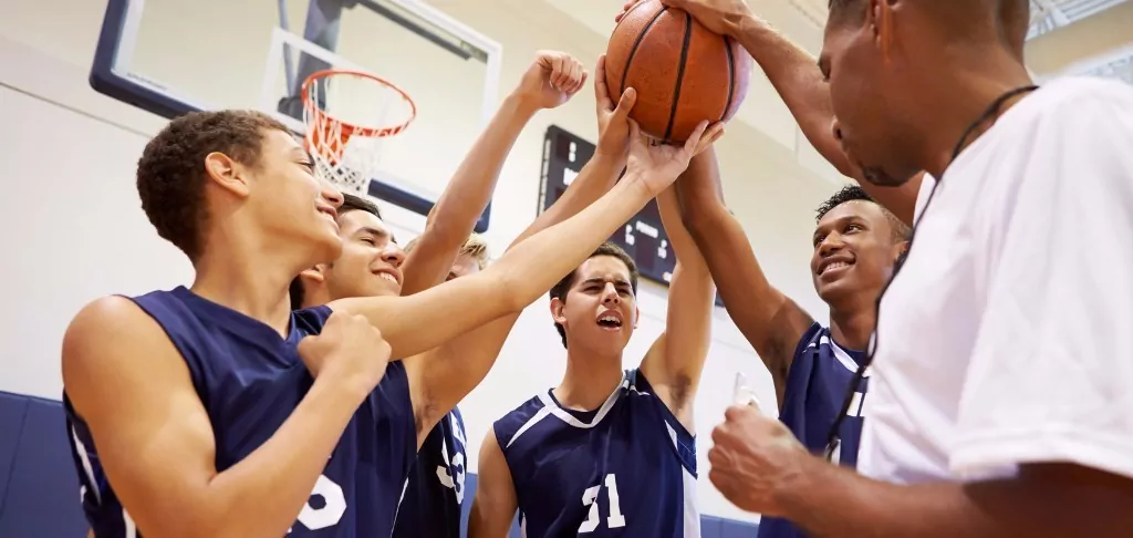 Basketball team in a huddle