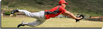 Baseball player diving to catch a ball