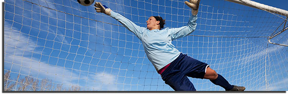 Woman playing goalie in soccer