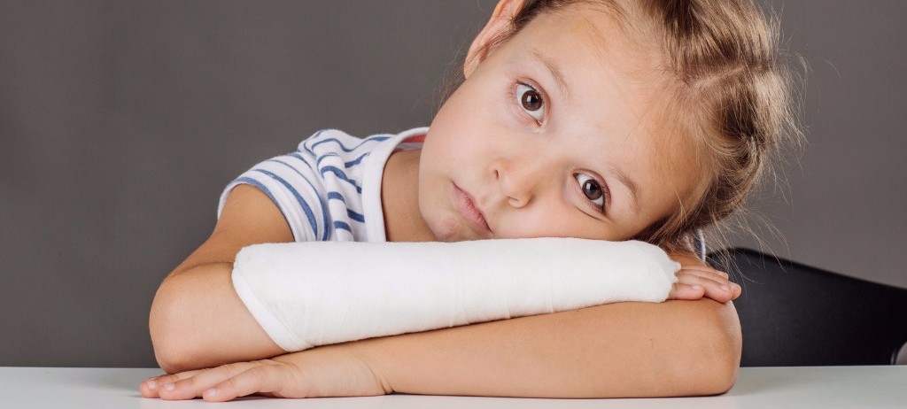 little girl with a wrist cast