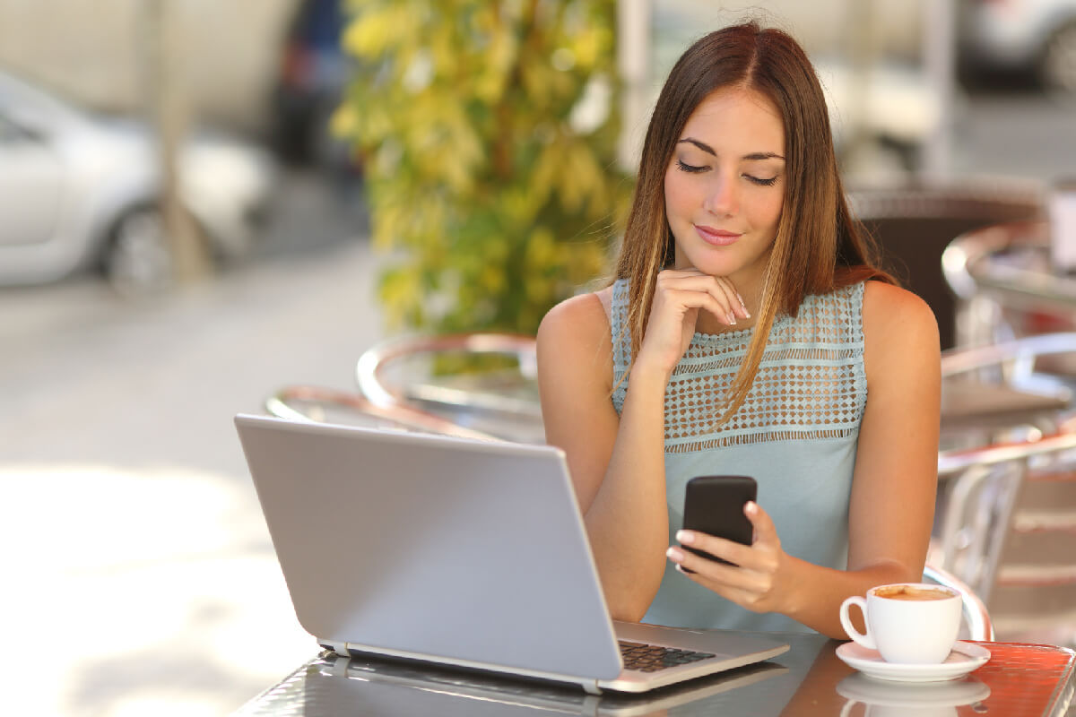 woman looking at her cell phone