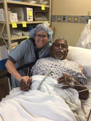 Emily Crow with Titus recovering from his knee replacement performed during a medical mission trip | Golden State Ortho | SF Bay Area, CA