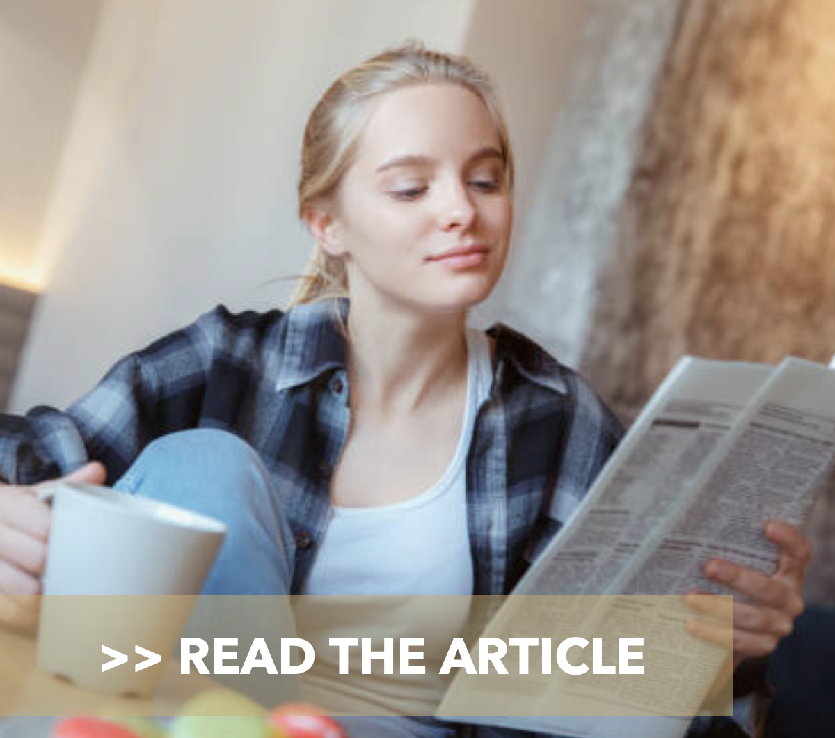photo of someone reading a newspaper